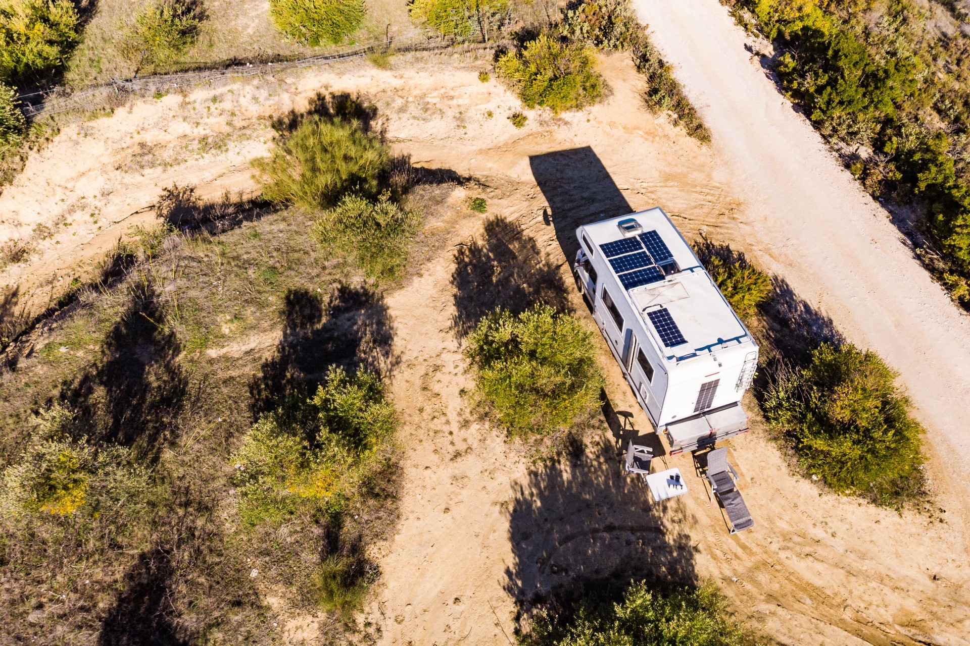Caravans with solar panels on roof camping on nature.